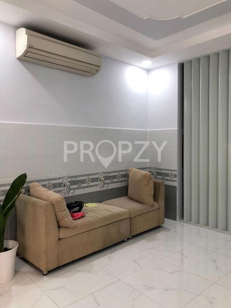 Nhà nguyên căn 1 trệt, 1 lầu ngang 4m, chiều dài 10m, ngay chợ Phú Nhuận, giá 12 triệu/tháng